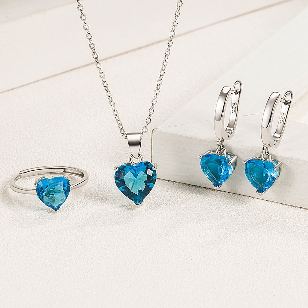 Set Completo Gioielli Cuore <titolo_esteso><span>collana orecchini e anello regolabile da donna in argento 925 placcato oro bianco con zirconi blu</span></titolo_esteso> - immagine 2